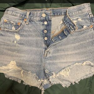 Levi’s shorts, raw hem at bottom.